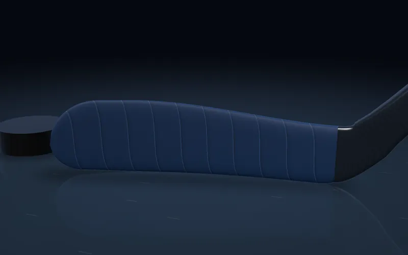 A hockey blade wrapped in navy cloth hockey tape with no overlap.